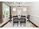 Elegant dining room showcasing coffered ceilings, a chandelier, and a traditional dining set at 4538 Brighton Ridge Dr, Apex, NC 27539