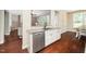 Kitchen area highlighting granite countertops, stainless steel appliances, and hardwood flooring at 4538 Brighton Ridge Dr, Apex, NC 27539