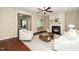 Inviting living room with a fireplace, ceiling fan, hardwood floors, and a decorative rug at 4538 Brighton Ridge Dr, Apex, NC 27539