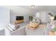 Inviting living room featuring comfortable seating, a modern TV, and stylish decor, creating a perfect relaxation space at 4538 Brighton Ridge Dr, Apex, NC 27539