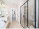 Stylish main bathroom with a shower, vanity, and walk-in closet for ample storage at 4538 Brighton Ridge Dr, Apex, NC 27539
