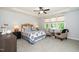 Spacious main bedroom features a trey ceiling, ceiling fan, and sitting area with natural light at 4538 Brighton Ridge Dr, Apex, NC 27539