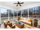 Comfortable screened porch with wicker furniture and a ceiling fan, perfect for outdoor relaxation at 4538 Brighton Ridge Dr, Apex, NC 27539