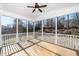 An empty screened porch with lots of light and great views of the trees and lawn at 4538 Brighton Ridge Dr, Apex, NC 27539