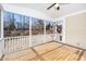 An empty screened porch with lots of light and views of the trees and lawn at 4538 Brighton Ridge Dr, Apex, NC 27539