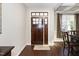 Front entrance with a dark wood door and hardwood floors at 4538 Brighton Ridge Dr, Fuquay Varina, NC 27526