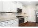 Kitchen with white cabinets, granite countertops, and stainless steel appliances at 4538 Brighton Ridge Dr, Apex, NC 27539