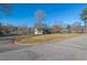 House sits on a large corner lot with mature trees at 4908 Winterlochen Rd, Raleigh, NC 27603