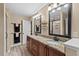 Updated bathroom with double vanity and granite countertops at 4908 Winterlochen Rd, Raleigh, NC 27603