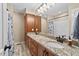 Bathroom with double sinks, granite countertop and bathtub at 4908 Winterlochen Rd, Raleigh, NC 27603