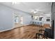 Living area features hardwood floors, fireplace, and French doors at 4908 Winterlochen Rd, Raleigh, NC 27603