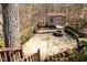 Backyard area featuring a charming shed, a cozy fire pit, and a paver patio, ideal for outdoor entertaining at 5240 Indigo Moon Way, Raleigh, NC 27613