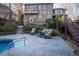 Beautiful backyard view featuring a serene pool, comfortable seating area, and lush greenery at 5240 Indigo Moon Way, Raleigh, NC 27613