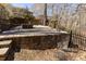 Multi-tiered backyard with stone retaining walls and a cozy firepit patio, perfect for outdoor gatherings at 5240 Indigo Moon Way, Raleigh, NC 27613