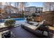 Expansive backyard view highlighting the pool, deck, and lush landscaping, creating a private oasis at 5240 Indigo Moon Way, Raleigh, NC 27613