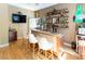 Custom bar featuring a granite countertop, lighting, beer signs and three bar stools at 5240 Indigo Moon Way, Raleigh, NC 27613