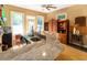 Entertaining bar area boasts granite countertops, custom cabinets, a wine rack and mini beverage cooler at 5240 Indigo Moon Way, Raleigh, NC 27613