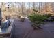 Well-equipped outdoor kitchen and barbecue area with wooden decking at 5240 Indigo Moon Way, Raleigh, NC 27613