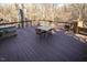 Spacious deck with table and chairs overlooking the woods at 5240 Indigo Moon Way, Raleigh, NC 27613