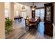 Dining room with hardwood floors and view of game room at 5240 Indigo Moon Way, Raleigh, NC 27613