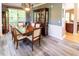 Dining room with hardwood floors, window, dining table, and china cabinet at 5240 Indigo Moon Way, Raleigh, NC 27613