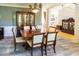 Elegant dining room with china cabinet, dining table, and hardwood floors at 5240 Indigo Moon Way, Raleigh, NC 27613