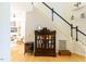 Grand foyer with hardwood floors, staircase, and decorative display cabinet at 5240 Indigo Moon Way, Raleigh, NC 27613