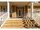 Two-story home with a welcoming front porch, brick steps and white railings at 5240 Indigo Moon Way, Raleigh, NC 27613