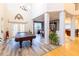 Grand two-story great room with hardwood floors, columns and pool table at 5240 Indigo Moon Way, Raleigh, NC 27613