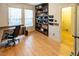 Spacious home office with built-in shelving and hardwood floors at 5240 Indigo Moon Way, Raleigh, NC 27613