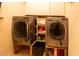 Laundry room with side-by-side washer and dryer and built-in shelving at 5240 Indigo Moon Way, Raleigh, NC 27613