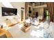 Bright and airy living room with hardwood floors, ample seating, and access to the 'Tavern' bar at 5240 Indigo Moon Way, Raleigh, NC 27613
