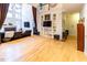 Two-story living room with hardwood floors, built-in shelving, and fireplace at 5240 Indigo Moon Way, Raleigh, NC 27613