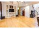 Open living area with hardwood floors, built-in shelving and fireplace at 5240 Indigo Moon Way, Raleigh, NC 27613