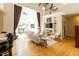 Bright living room showcases hardwood floors, fireplace, and abundant natural light from large windows at 5240 Indigo Moon Way, Raleigh, NC 27613