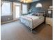 Spacious main bedroom with king-size bed and access to a balcony at 5240 Indigo Moon Way, Raleigh, NC 27613