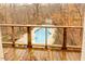 Inviting kidney-shaped pool with a wooden deck overlooking the woods at 5240 Indigo Moon Way, Raleigh, NC 27613