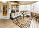 Cozy screened porch features wicker furniture and wooded views at 5240 Indigo Moon Way, Raleigh, NC 27613
