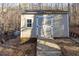 Backyard shed with double doors and a ramp for easy access and additional storage at 5240 Indigo Moon Way, Raleigh, NC 27613