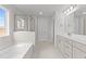 Primary bathroom with soaking tub and walk-in shower at 529 Ravensworth Dr, Garner, NC 27529