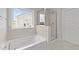 Bathroom with a shower and garden tub at 529 Ravensworth Dr, Garner, NC 27529