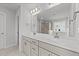 Double vanity bathroom with a large mirror and toilet at 529 Ravensworth Dr, Garner, NC 27529