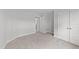 Well-lit bedroom with ample closet space and carpet at 529 Ravensworth Dr, Garner, NC 27529