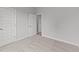 Bedroom with carpet, neutral walls and two doors at 529 Ravensworth Dr, Garner, NC 27529