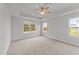 Primary bedroom with ceiling fan and large windows at 529 Ravensworth Dr, Garner, NC 27529