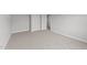 Spacious bedroom with carpeted floors and double doors at 529 Ravensworth Dr, Garner, NC 27529