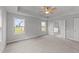 Spacious bedroom with carpeting, ceiling fan, and access to a private bathroom at 529 Ravensworth Dr, Garner, NC 27529