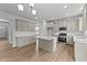 Modern kitchen with island, stainless steel appliances, and white cabinets at 529 Ravensworth Dr, Garner, NC 27529