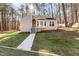 Cute ranch home with a walkway leading to the front entrance at 6 Pine Tree Ln, Chapel Hill, NC 27514