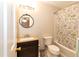 Bathroom with shower/tub combo, vanity, and floral shower curtain at 6700 Chauncey Dr, Raleigh, NC 27615